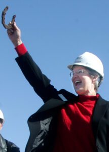 woman holding a horse shoe