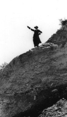 woman standing on a hill