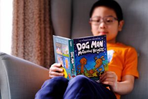 Tween reading a book