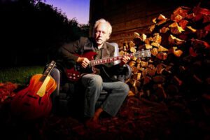 Mountain Sam Wheelock playing his guitar