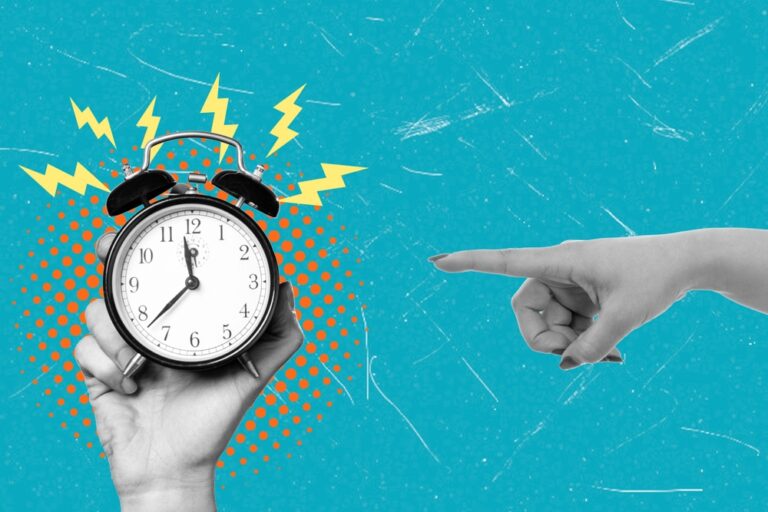 hand pointing at a clock