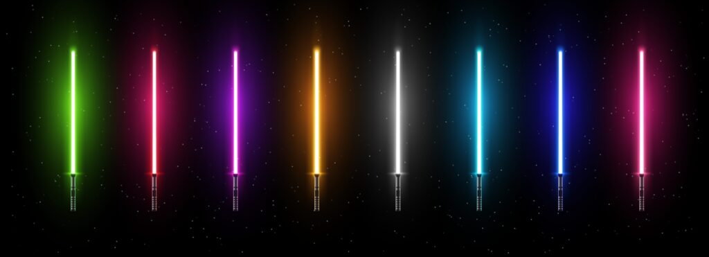 Rainbow colored light sabers, with a black background.